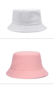 Detailed view of oversized breathable bucket hats in white and pink colors.
