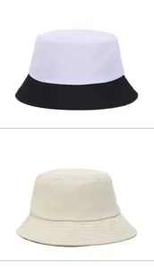Detailed view of two oversized bucket hats in black-white contrast and solid beige