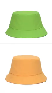Vertical display of two oversized bucket hats in vibrant neon green and classic orange
