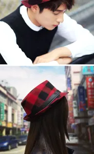 Detailansicht des rot-schwarz karierten Fedora-Hutes, getragen von asiatischen Models