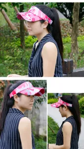 Pink camouflage empty-top sun visor hat shown in outdoor park from three different angles