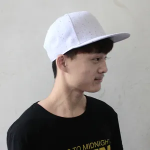 White hip hop flat brim hat with colorful splatter paint pattern for outdoor fashion.