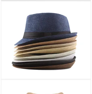 A colorful stack of breathable paper straw jazz hats for stylish summer sun protection