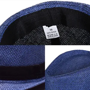 Detailed view of blue woven paper straw jazz hat with interior size 58 label shown