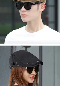 Detail view of retro unisex beret hat with rivets worn by models in outdoor setting
