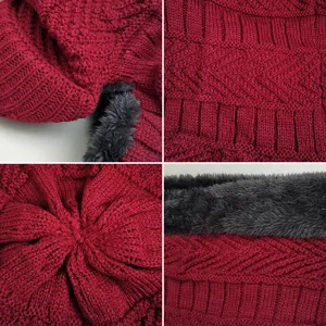 Detailed view of burgundy knit winter hat with thick grey fleece lining for warmth
