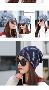 Stylish women's outdoor beanie with feather print, shown in a trendy street style look.