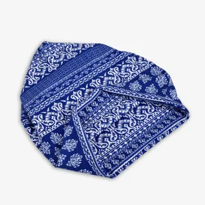 Close-up of blue and white paisley pattern on a soft cotton bandana pullover hat