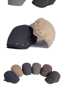 Detailed view of various vintage berets with metal rivet accents in multiple colors