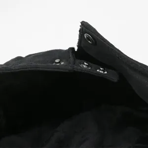 Close-up of black suede beret with functional snap buttons and warm fleece lining