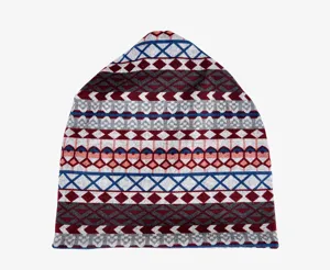 Detail of a knit turban hat with vintage ethnic geometric patterns in dark red and blue
