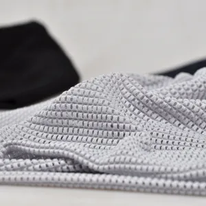 Close-up of breathable light gray mesh skull cap with honeycomb texture for summer