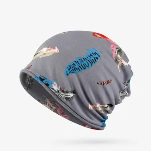 Detail of gray turban beanie with colorful feather print pattern