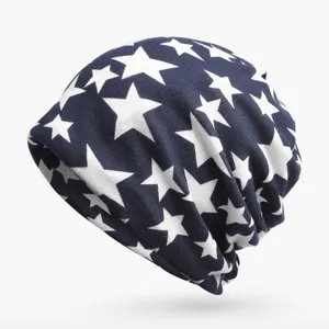 Slouchy navy blue beanie featuring an all-over white star pattern on a clean white background.
