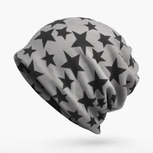 Detail of the gray slouchy beanie with stylish black star pattern and soft texture