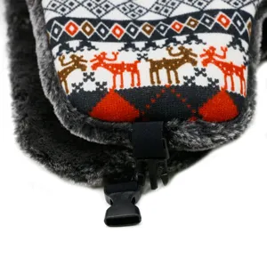 Detailed view of winter trapper hat with knit reindeer pattern and warm faux fur lining