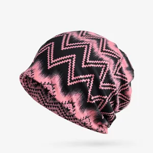 Close-up of pink and black zigzag geometric pattern on a trendy slouchy beanie hat