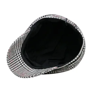 Classic black and white plaid newsboy cap with vintage British beret style design