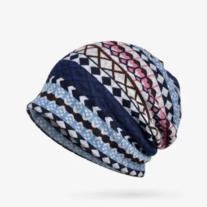 Detailed macro view of women's slouchy beanie hat featuring colorful geometric patterns