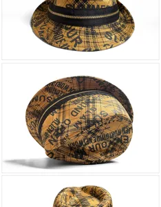 Detail shot of yellow plaid fedora hat featuring black zipper band and graffiti print.