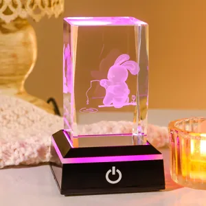 Detail view of 3D laser engraved crystal cube with glowing bunny fishing design