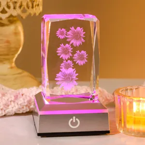 Close-up of 3D laser-engraved daisy pattern inside an illuminated crystal night light