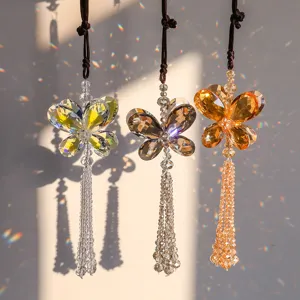 Butterfly crystal car pendants with rainbow prism light reflections in three colors.