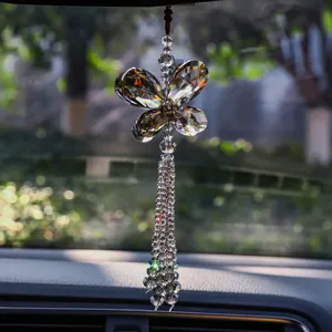 Close-up of sparkling butterfly crystal car hanging ornament with beaded tassels.