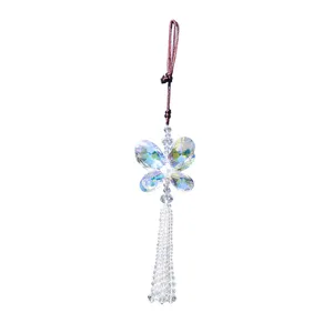 Detailed view of a faceted crystal butterfly car hanging ornament with beaded tassel