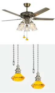 Detailed view of amber diamond-shaped crystal pull chain pendants for ceiling fan lights