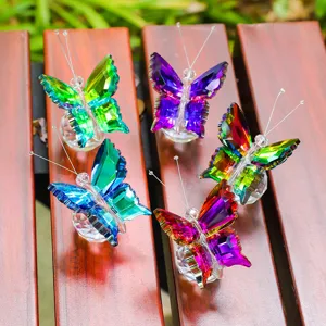 Handcrafted colorful crystal butterfly figurines on wooden slats for home decor and gifts