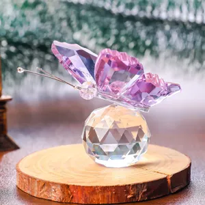 Detailed view of elegant purple faceted crystal butterfly figurine on a clear crystal ball base