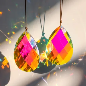 Close-up of teardrop K9 crystal prisms with colorful rainbow light reflections