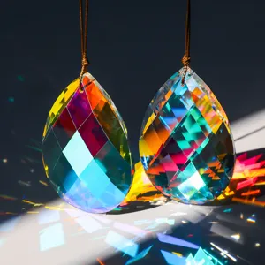 Macro detail view of two K9 crystal faceted prism suncatchers reflecting vibrant rainbow light