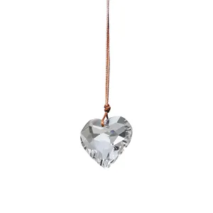 Faceted K9 crystal heart prism pendant showing intricate light-catching glass details