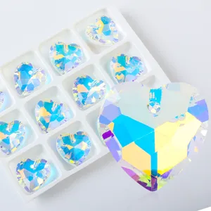 Macro detail of iridescent heart-shaped crystal pendants for DIY jewelry making accessories.