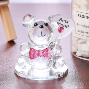 Detail view of crystal bear figurine with sparkling pink bow tie and Best Friend heart wand