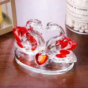 Elegant clear and red crystal swan figurine ornament for home decor or wedding gift.