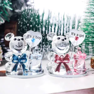 A pair of crystal bear figurines featuring "It's a boy" and "It's a girl" heart accents.