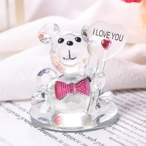 Detail shot of crystal teddy bear figurine holding an I LOVE YOU heart ornament