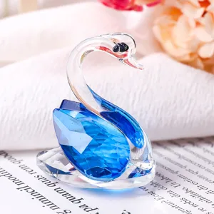 Close-up detail of blue and clear crystal swan ornament with multi-faceted cut
