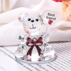 Detailed close-up of a clear crystal bear figurine holding a Best friend heart sign