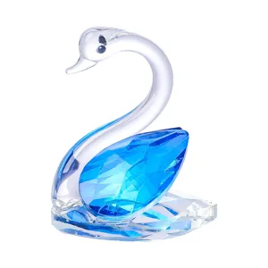 Elegant blue and clear faceted crystal swan figurine ornament for wedding or home decor.