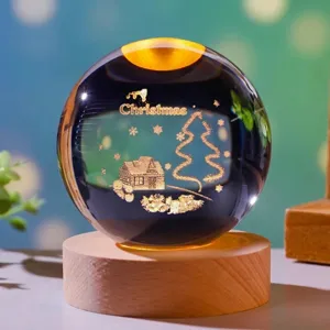 Detailed engraving of Christmas tree inside glowing crystal ball night light