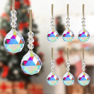 Detailed view of faceted crystal Christmas ornaments with colorful rainbow reflections.