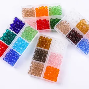 Top view of colorful faceted glass beads organized in clear 6-compartment storage boxes
