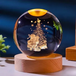 Detailed view of glowing Christmas crystal ball with Santa Claus and wooden base