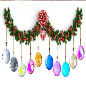 Macro view of colorful 30mm faceted crystal prisms hanging from a festive Christmas garland.