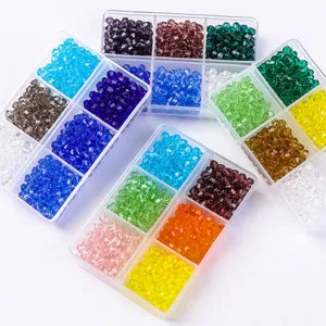 Close-up detail of 4mm faceted bicone glass beads in multi-color organizer boxes for DIY crafts