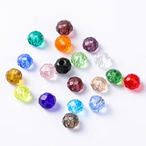 Detailed overhead view of various colorful faceted crystal glass beads for DIY jewelry crafts